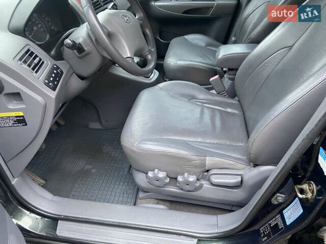 Зеленый Хендай Туксон, объемом двигателя 1.98 л и пробегом 200 тыс. км за 8500 $, фото 12 на Automoto.ua