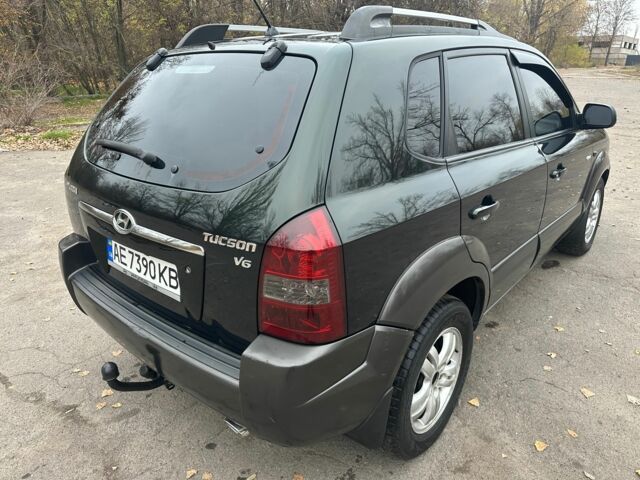 Зеленый Хендай Туксон, объемом двигателя 2.7 л и пробегом 250 тыс. км за 7850 $, фото 5 на Automoto.ua