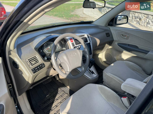 Зеленый Хендай Туксон, объемом двигателя 1.99 л и пробегом 208 тыс. км за 7600 $, фото 8 на Automoto.ua