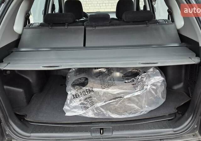 Зеленый Хендай Туксон, объемом двигателя 1.98 л и пробегом 241 тыс. км за 6900 $, фото 11 на Automoto.ua