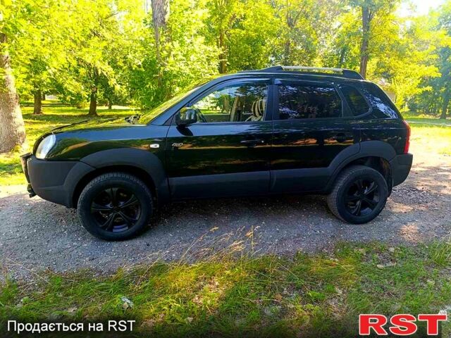 Зеленый Хендай Туксон, объемом двигателя 2 л и пробегом 210 тыс. км за 7699 $, фото 3 на Automoto.ua