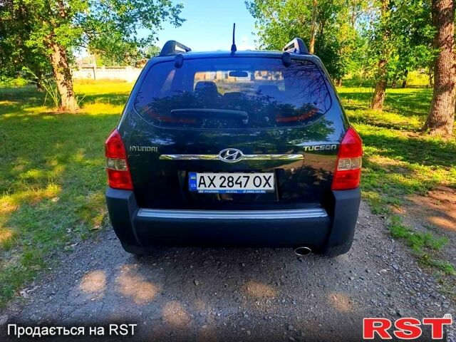 Зеленый Хендай Туксон, объемом двигателя 2 л и пробегом 210 тыс. км за 7699 $, фото 5 на Automoto.ua