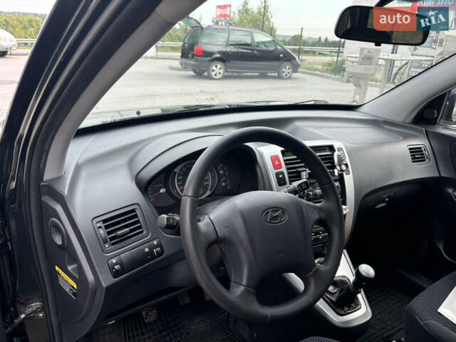 Зелений Хендай Туксон, об'ємом двигуна 2.02 л та пробігом 239 тис. км за 7800 $, фото 7 на Automoto.ua