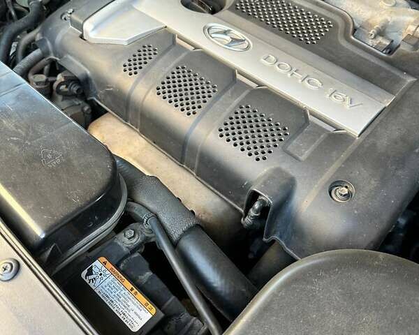 Зелений Хендай Туксон, об'ємом двигуна 1.98 л та пробігом 188 тис. км за 7900 $, фото 9 на Automoto.ua