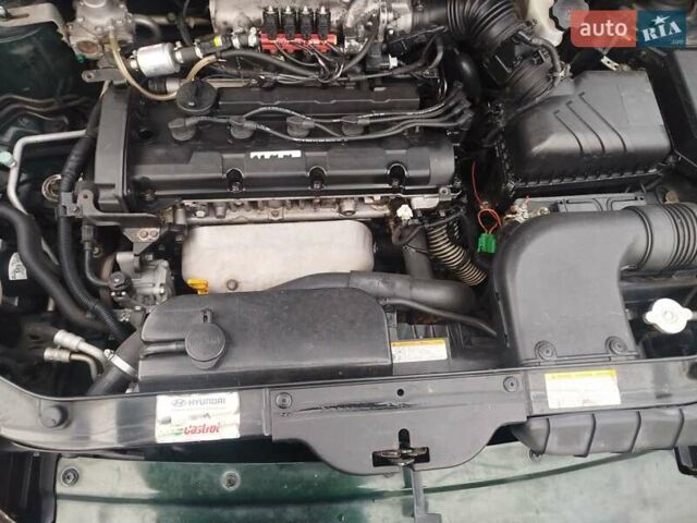 Зеленый Хендай Туксон, объемом двигателя 1.98 л и пробегом 310 тыс. км за 6200 $, фото 13 на Automoto.ua