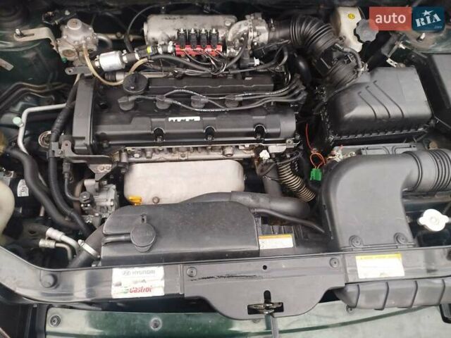 Зеленый Хендай Туксон, объемом двигателя 1.98 л и пробегом 310 тыс. км за 6200 $, фото 14 на Automoto.ua