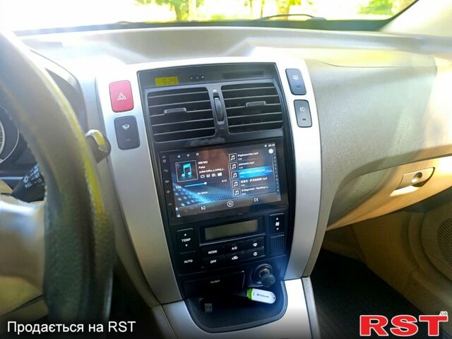 Зеленый Хендай Туксон, объемом двигателя 2 л и пробегом 210 тыс. км за 7699 $, фото 8 на Automoto.ua