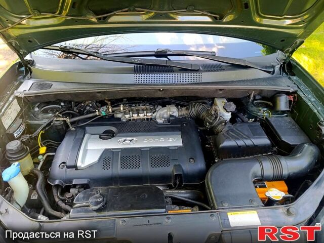 Зеленый Хендай Туксон, объемом двигателя 2 л и пробегом 210 тыс. км за 7699 $, фото 12 на Automoto.ua