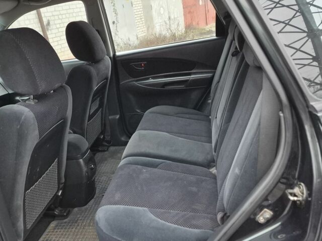 Зеленый Хендай Туксон, объемом двигателя 2 л и пробегом 241 тыс. км за 6900 $, фото 6 на Automoto.ua