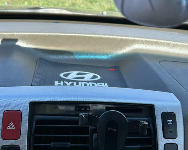 Зелений Хендай Туксон, об'ємом двигуна 1.98 л та пробігом 301 тис. км за 8350 $, фото 10 на Automoto.ua