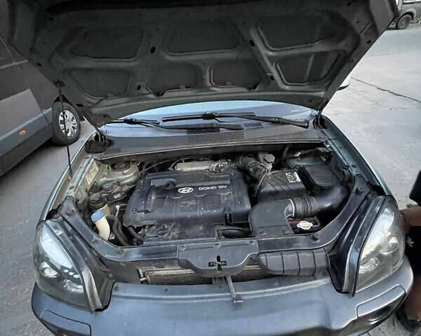 Зеленый Хендай Туксон, объемом двигателя 1.98 л и пробегом 205 тыс. км за 7700 $, фото 31 на Automoto.ua