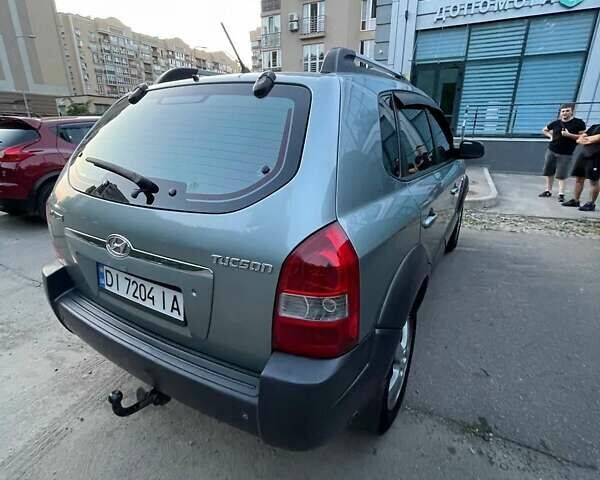 Зеленый Хендай Туксон, объемом двигателя 1.98 л и пробегом 205 тыс. км за 7700 $, фото 3 на Automoto.ua