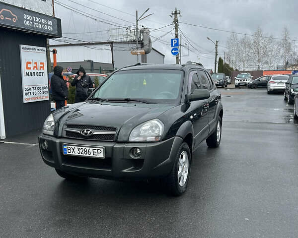 Зеленый Хендай Туксон, объемом двигателя 1.98 л и пробегом 237 тыс. км за 7500 $, фото 1 на Automoto.ua