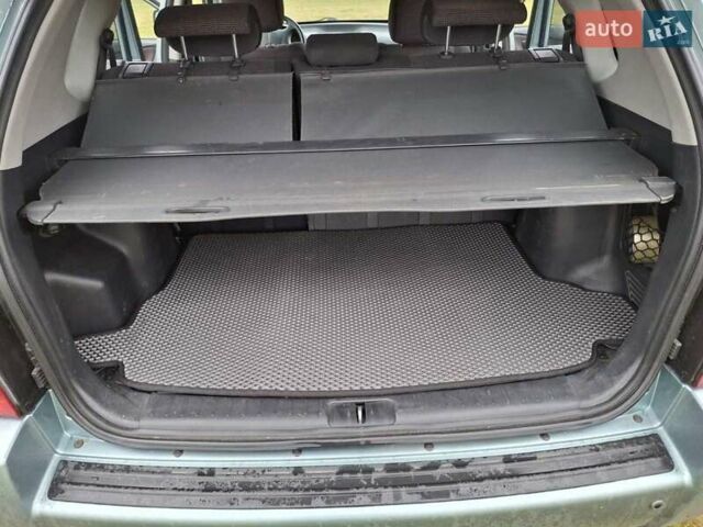 Зеленый Хендай Туксон, объемом двигателя 1.98 л и пробегом 129 тыс. км за 9200 $, фото 6 на Automoto.ua