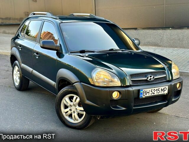 Зеленый Хендай Туксон, объемом двигателя 2 л и пробегом 172 тыс. км за 7000 $, фото 3 на Automoto.ua