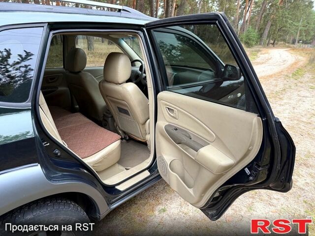 Зеленый Хендай Туксон, объемом двигателя 2 л и пробегом 185 тыс. км за 7950 $, фото 8 на Automoto.ua