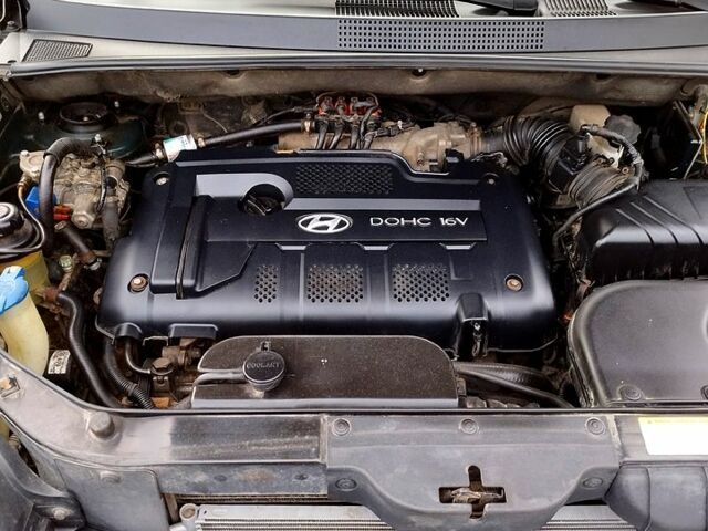 Зеленый Хендай Туксон, объемом двигателя 2 л и пробегом 350 тыс. км за 7600 $, фото 5 на Automoto.ua