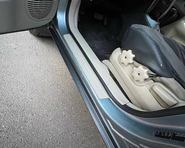 Зеленый Хендай Туксон, объемом двигателя 1.98 л и пробегом 205 тыс. км за 7700 $, фото 11 на Automoto.ua