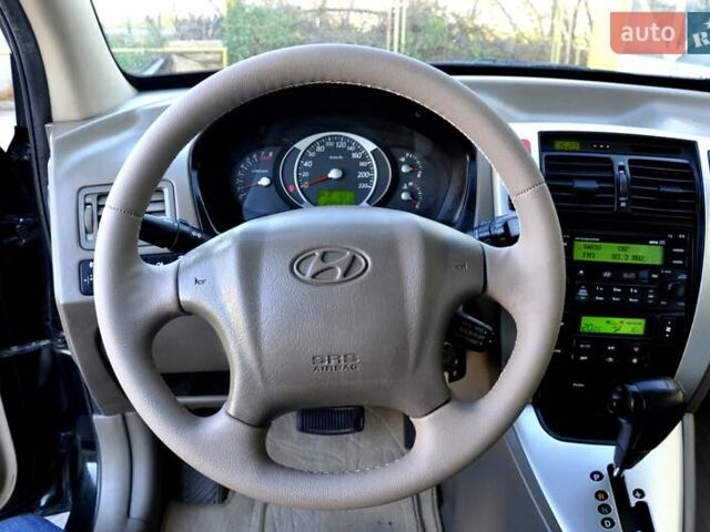 Зеленый Хендай Туксон, объемом двигателя 1.98 л и пробегом 245 тыс. км за 7200 $, фото 35 на Automoto.ua