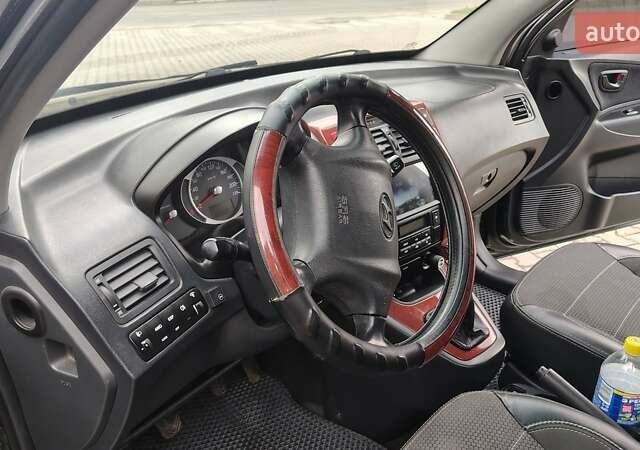 Зелений Хендай Туксон, об'ємом двигуна 1.98 л та пробігом 245 тис. км за 7800 $, фото 29 на Automoto.ua