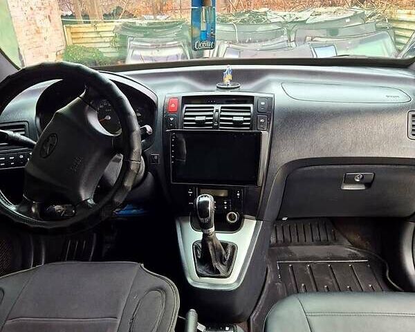 Зелений Хендай Туксон, об'ємом двигуна 2 л та пробігом 276 тис. км за 9000 $, фото 6 на Automoto.ua