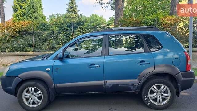 Зеленый Хендай Туксон, объемом двигателя 2 л и пробегом 250 тыс. км за 4000 $, фото 6 на Automoto.ua