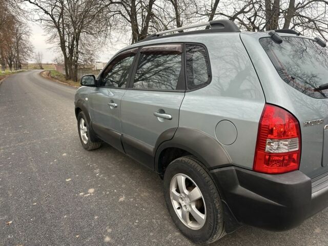 Зеленый Хендай Туксон, объемом двигателя 2 л и пробегом 190 тыс. км за 6150 $, фото 5 на Automoto.ua