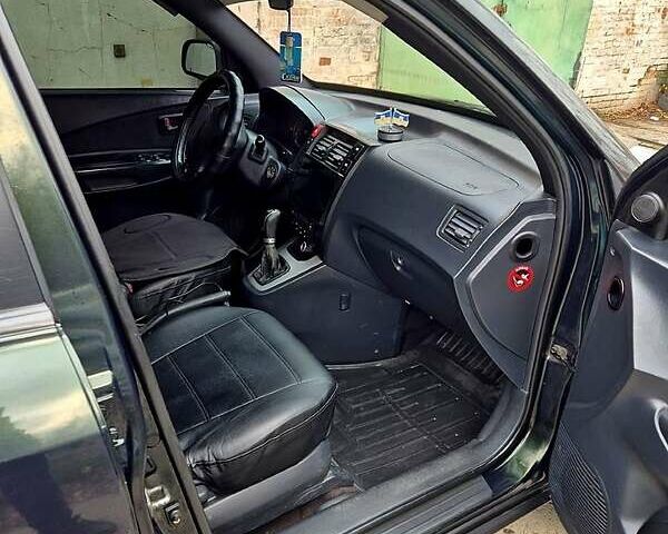 Зелений Хендай Туксон, об'ємом двигуна 2 л та пробігом 276 тис. км за 9000 $, фото 2 на Automoto.ua