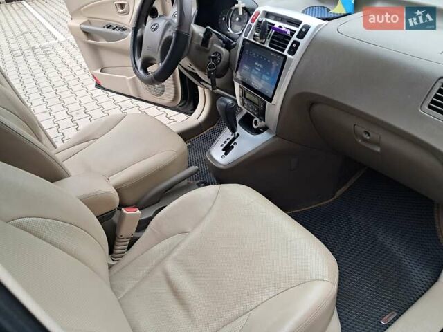 Зеленый Хендай Туксон, объемом двигателя 1.98 л и пробегом 280 тыс. км за 7200 $, фото 26 на Automoto.ua