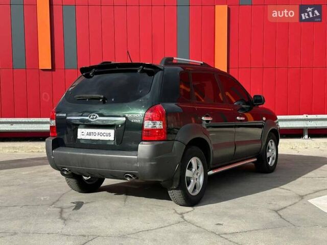 Зеленый Хендай Туксон, объемом двигателя 1.99 л и пробегом 214 тыс. км за 7990 $, фото 7 на Automoto.ua