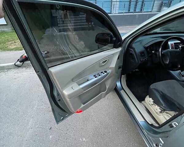 Зеленый Хендай Туксон, объемом двигателя 1.98 л и пробегом 205 тыс. км за 7700 $, фото 16 на Automoto.ua