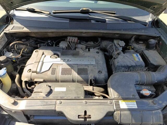 Зелений Хендай Туксон, об'ємом двигуна 2 л та пробігом 203 тис. км за 7200 $, фото 8 на Automoto.ua