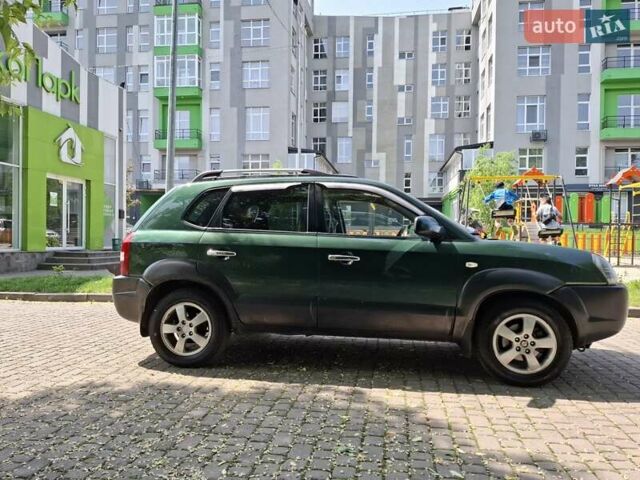 Зелений Хендай Туксон, об'ємом двигуна 2 л та пробігом 226 тис. км за 4550 $, фото 5 на Automoto.ua
