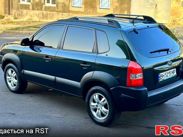 Зеленый Хендай Туксон, объемом двигателя 2 л и пробегом 172 тыс. км за 7000 $, фото 1 на Automoto.ua