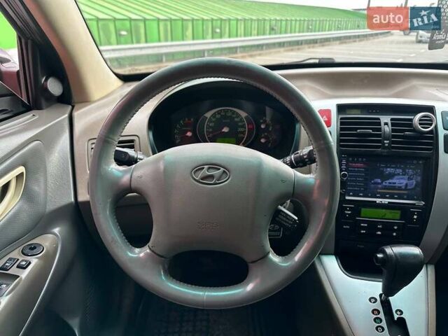 Зеленый Хендай Туксон, объемом двигателя 1.99 л и пробегом 214 тыс. км за 7290 $, фото 14 на Automoto.ua