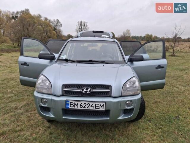 Зеленый Хендай Туксон, объемом двигателя 1.98 л и пробегом 129 тыс. км за 9200 $, фото 5 на Automoto.ua