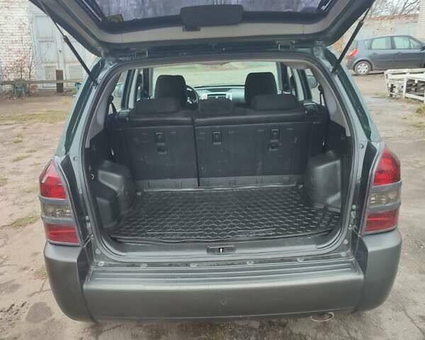 Зеленый Хендай Туксон, объемом двигателя 2 л и пробегом 213 тыс. км за 6500 $, фото 10 на Automoto.ua