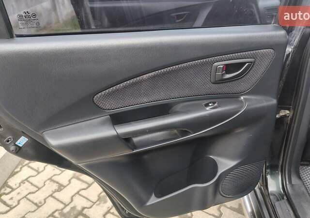 Зелений Хендай Туксон, об'ємом двигуна 1.98 л та пробігом 245 тис. км за 7800 $, фото 23 на Automoto.ua