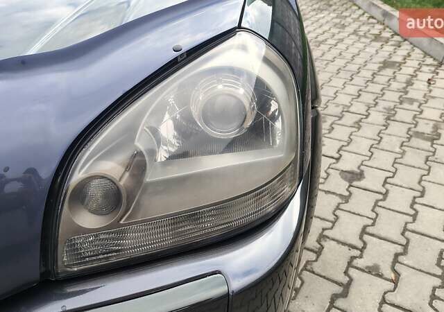 Зелений Хендай Туксон, об'ємом двигуна 1.98 л та пробігом 245 тис. км за 7800 $, фото 13 на Automoto.ua