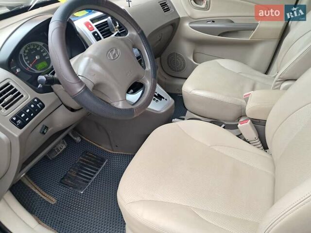 Зеленый Хендай Туксон, объемом двигателя 1.98 л и пробегом 280 тыс. км за 7200 $, фото 19 на Automoto.ua