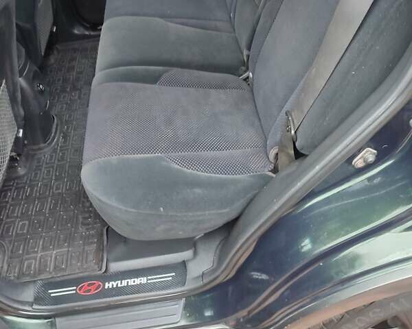 Зеленый Хендай Туксон, объемом двигателя 2 л и пробегом 213 тыс. км за 6500 $, фото 9 на Automoto.ua