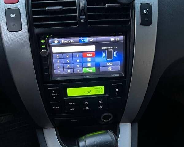 Зеленый Хендай Туксон, объемом двигателя 1.98 л и пробегом 205 тыс. км за 7700 $, фото 17 на Automoto.ua