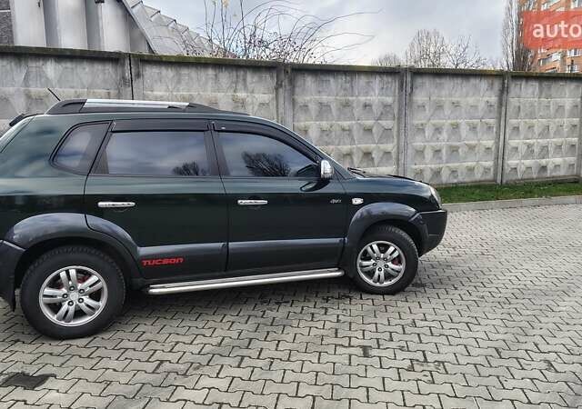 Зелений Хендай Туксон, об'ємом двигуна 1.98 л та пробігом 245 тис. км за 7800 $, фото 5 на Automoto.ua