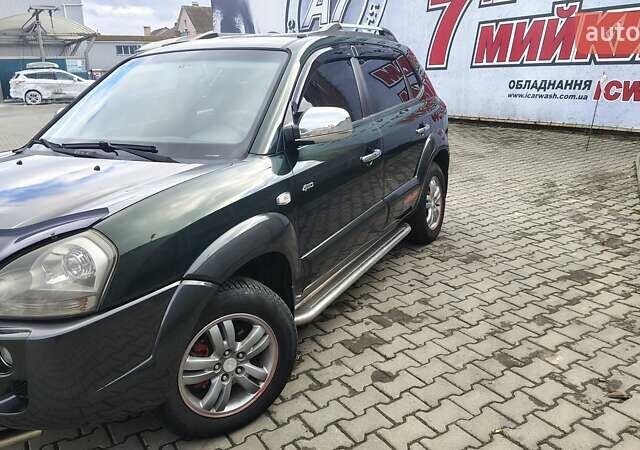 Зелений Хендай Туксон, об'ємом двигуна 1.98 л та пробігом 245 тис. км за 7800 $, фото 17 на Automoto.ua