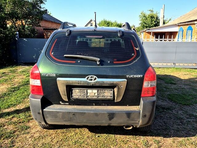 Зеленый Хендай Туксон, объемом двигателя 2 л и пробегом 135 тыс. км за 8500 $, фото 1 на Automoto.ua