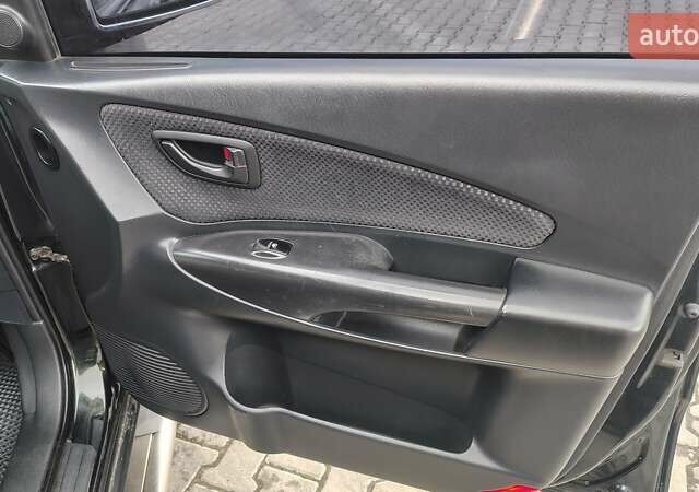 Зелений Хендай Туксон, об'ємом двигуна 1.98 л та пробігом 245 тис. км за 7800 $, фото 21 на Automoto.ua