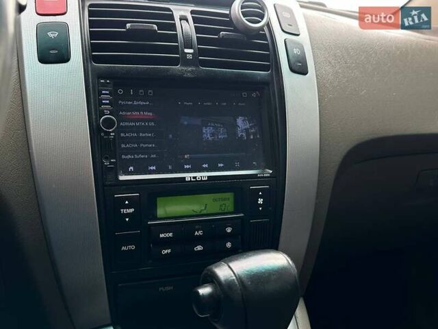 Зеленый Хендай Туксон, объемом двигателя 1.99 л и пробегом 214 тыс. км за 7990 $, фото 22 на Automoto.ua