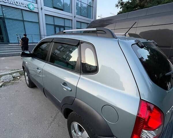 Зеленый Хендай Туксон, объемом двигателя 1.98 л и пробегом 205 тыс. км за 7700 $, фото 13 на Automoto.ua