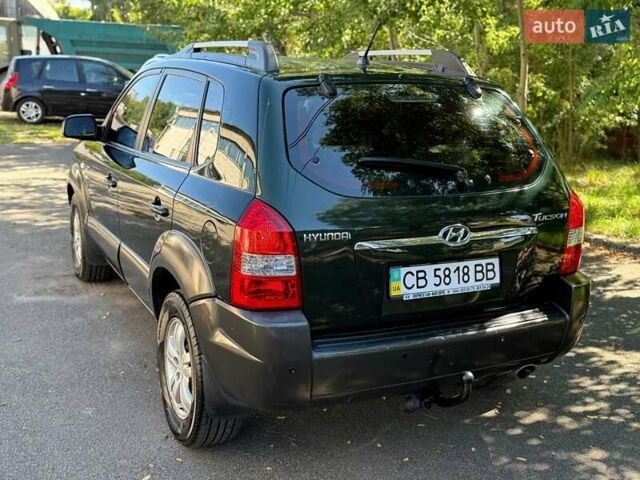 Зелений Хендай Туксон, об'ємом двигуна 1.98 л та пробігом 185 тис. км за 8100 $, фото 13 на Automoto.ua