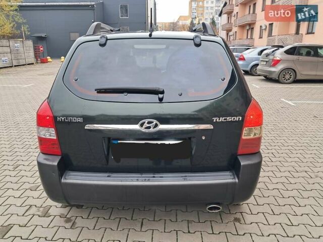 Зеленый Хендай Туксон, объемом двигателя 1.98 л и пробегом 280 тыс. км за 7200 $, фото 5 на Automoto.ua